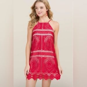 Francesca’s Red strappy crochet / lace type overlay over nude